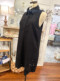 side view of black sleeveless dress with eyelet details 