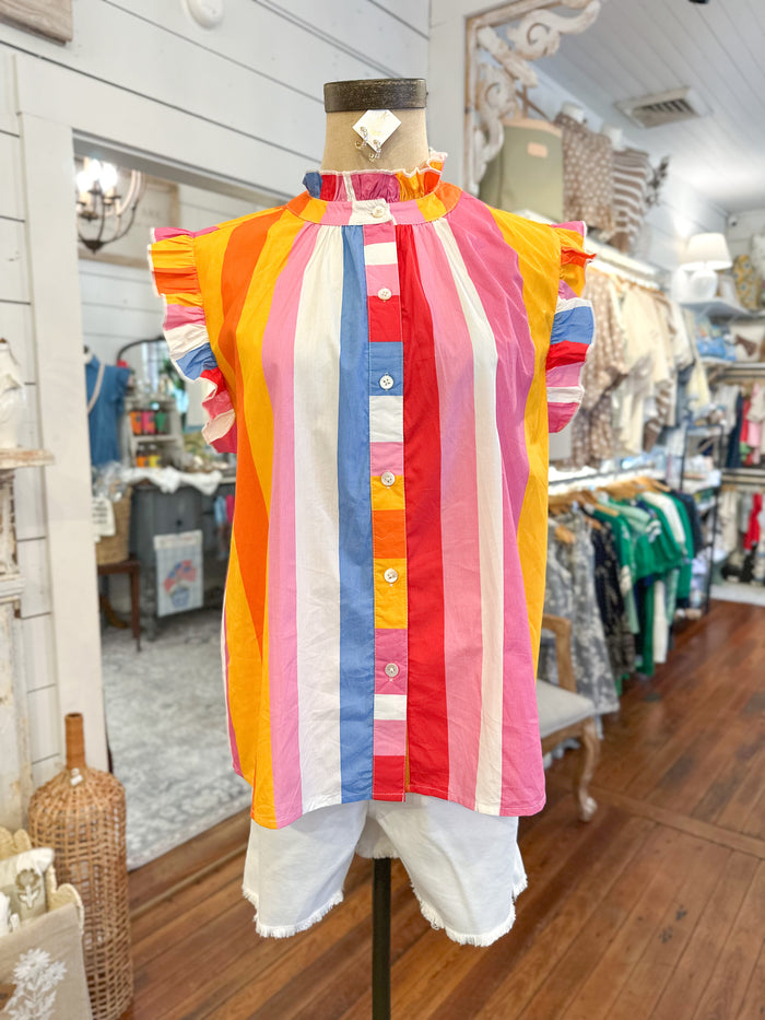 Colorful striped shirt on a mannequin in a store setting