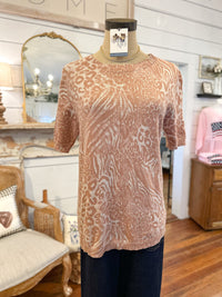 Patterned sweater on a mannequin in a store setting