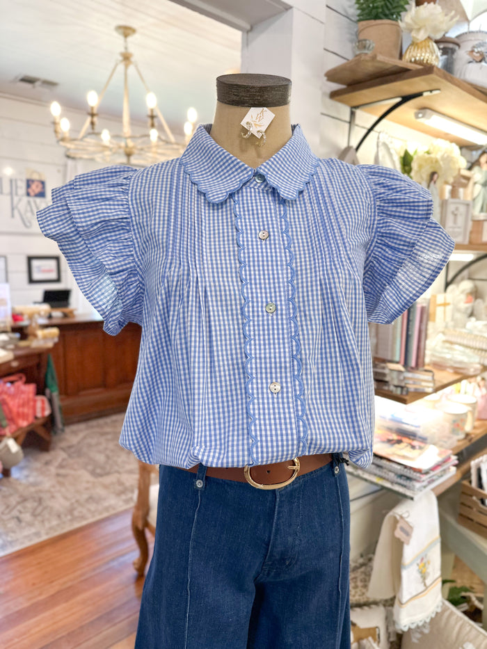 blue and white checkered top with scallop details and buttons down the front entro brand 
