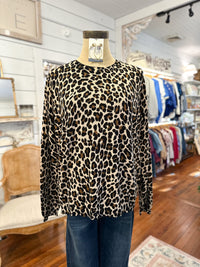 Leopard print sweater on a mannequin in a store setting