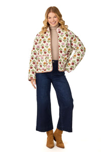 Woman wearing a floral quilted jacket on a white background mud pie floral jacket 