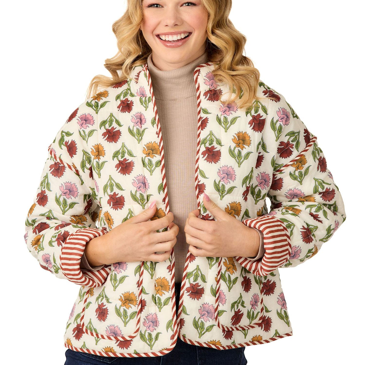 Woman wearing a floral patterned jacket with stripes on a white background mud pie harvest floral jacket 