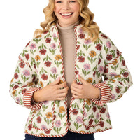 Woman wearing a floral patterned jacket with stripes on a white background mud pie harvest floral jacket 