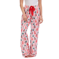 Pajama pants with candy cane and bow pattern on a white background