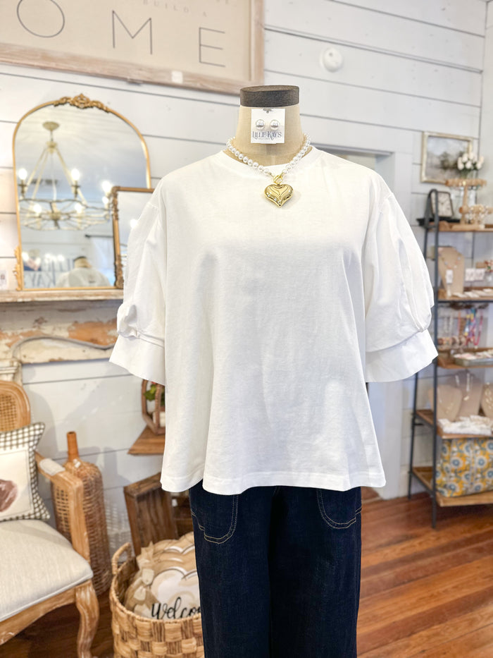 white 2 contrast style top t shirt material in the front and back is more of dress shirt cotton material 