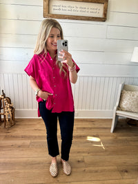 bright pink collared short sleeve top with buttons