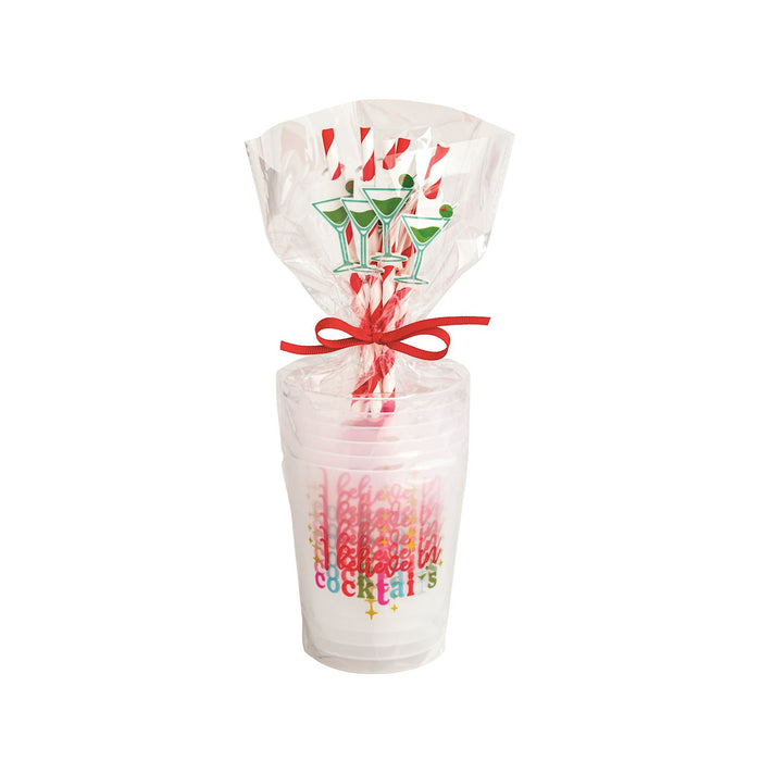 Clear tumbler with colorful text, red ribbon, and straws in a clear bag on a white background