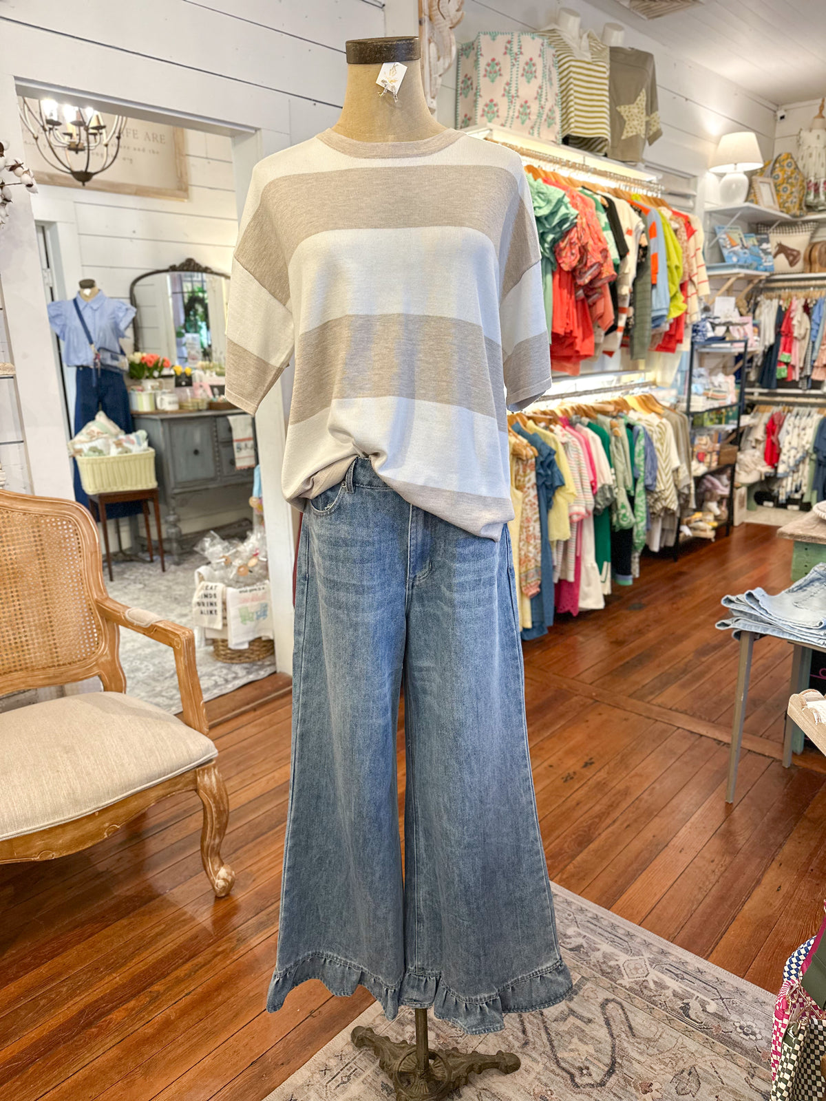 mannequin wearing light wash ruffle hem jeans 