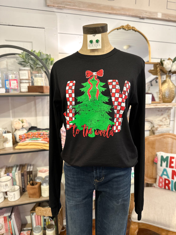 Black long-sleeve shirt with Christmas tree and candy cane design on a mannequin in a store setting.