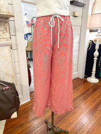 Red checkered pants on a mannequin in a store setting