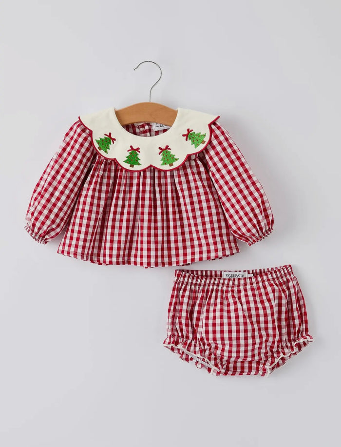 Red and white checkered baby outfit with Christmas tree details on a white background