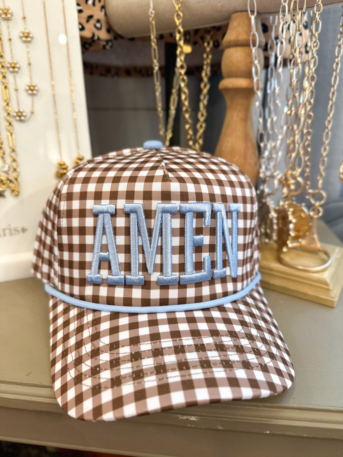 brown and cream checkered print hat with amen in blue thread 