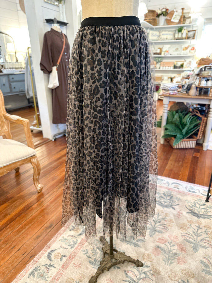 Leopard print tule sheer skirt on a mannequin in a store setting