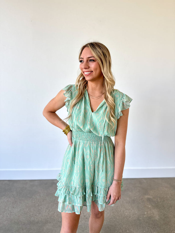 mint green printed dress with elastic at the waist