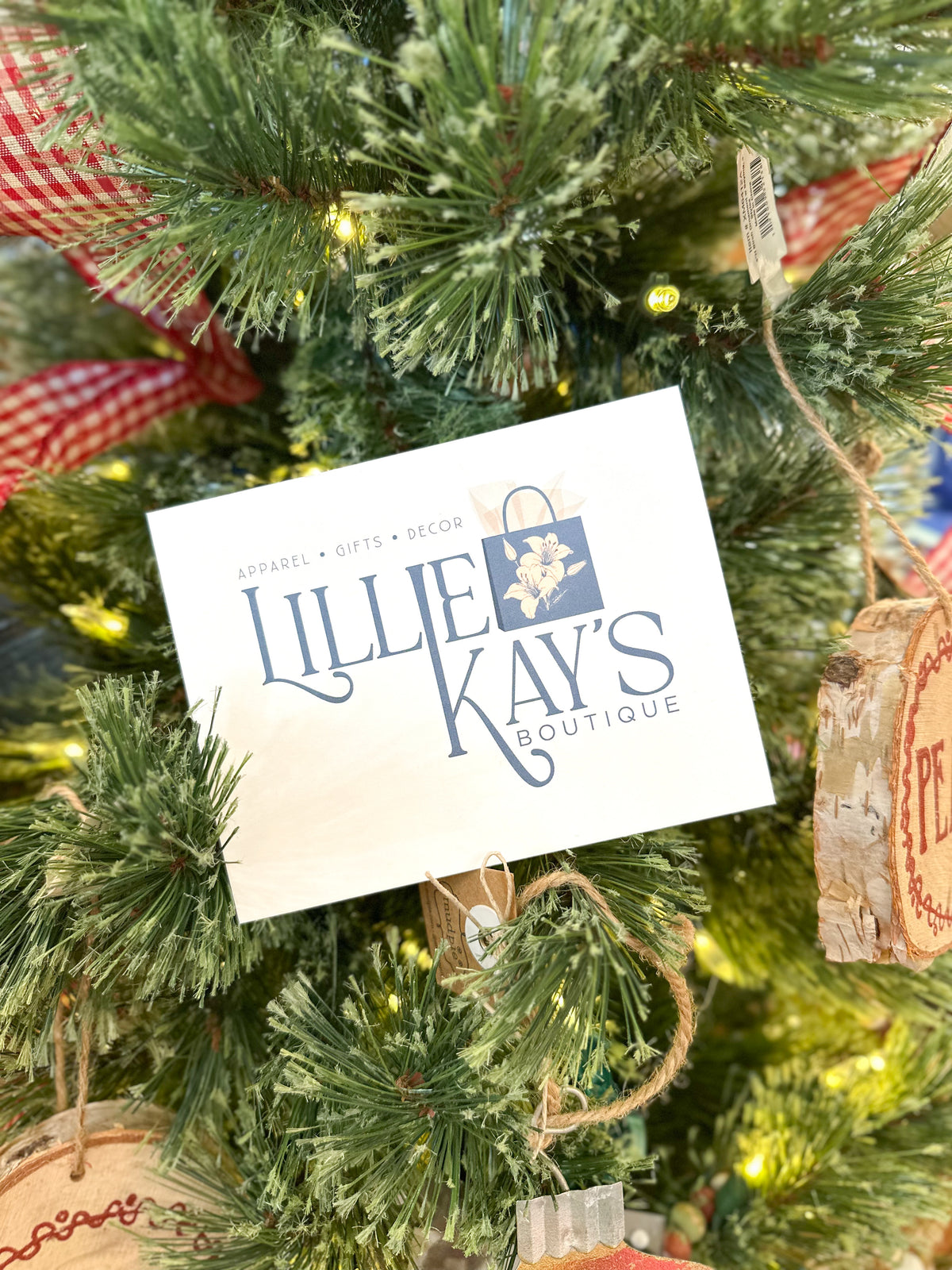 Lillie Kay's Boutique sign on a decorated Christmas tree