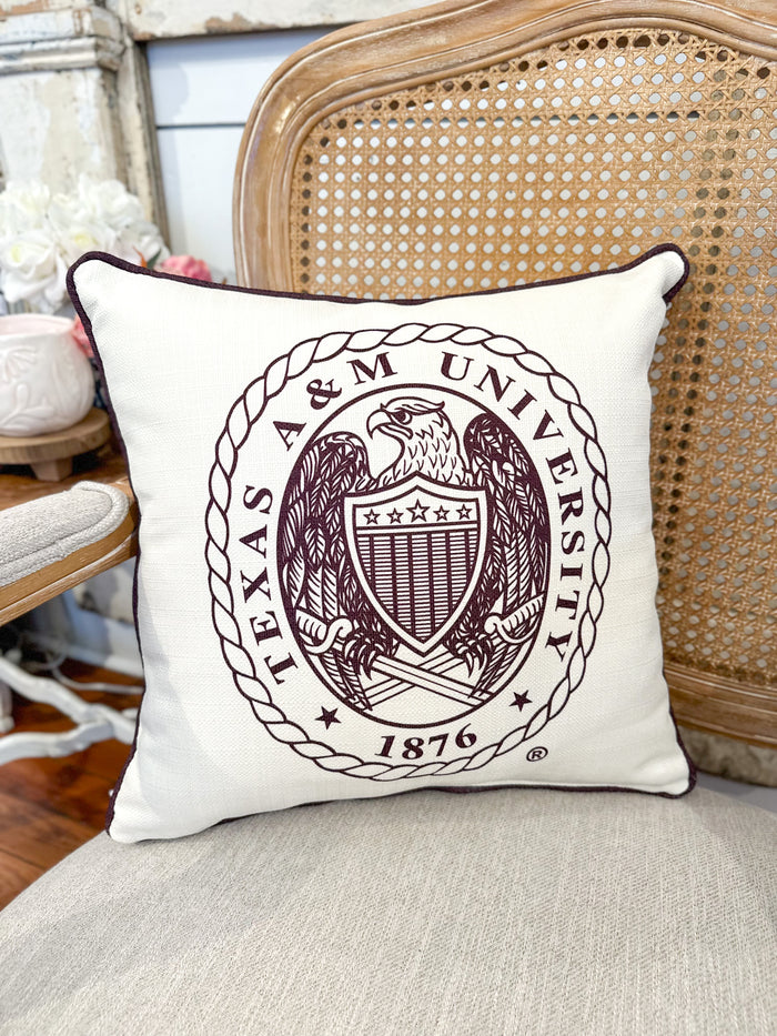 Pillow with Texas A&M University emblem on a chair