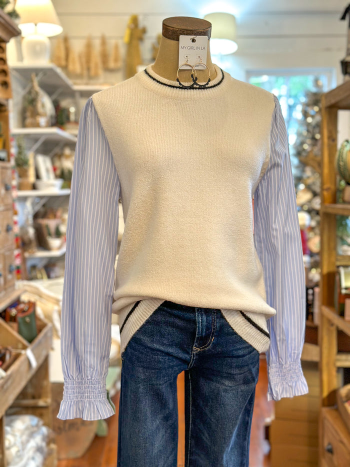cream sweater with blue and white pin stripe sleeves