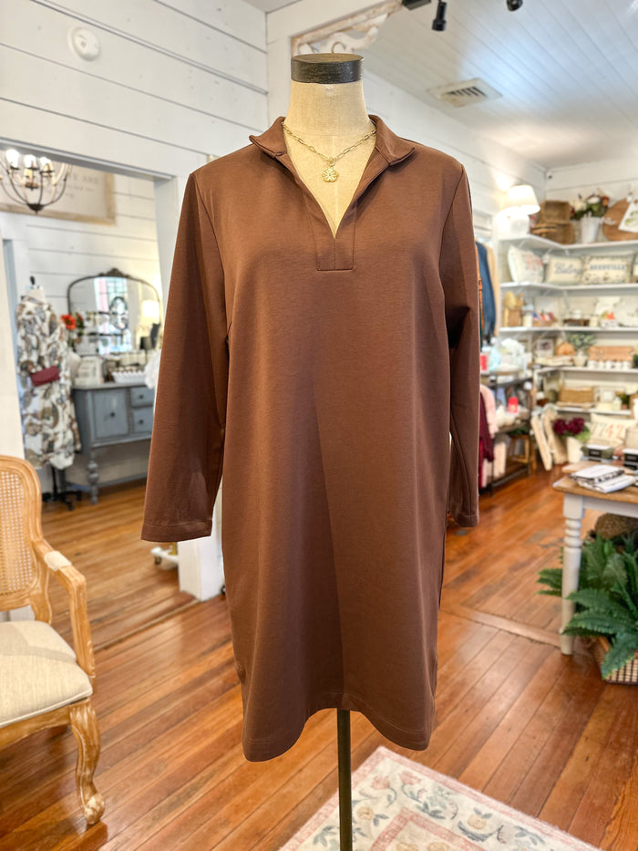 Brown dress on a mannequin in a store setting