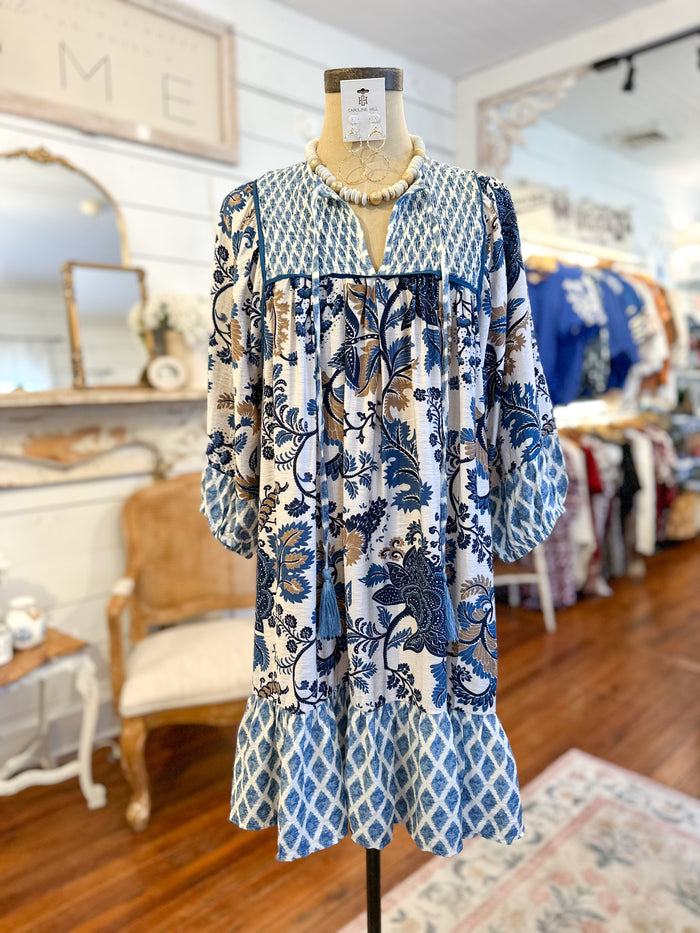 blue tan and cream printed dress with long sleeves 