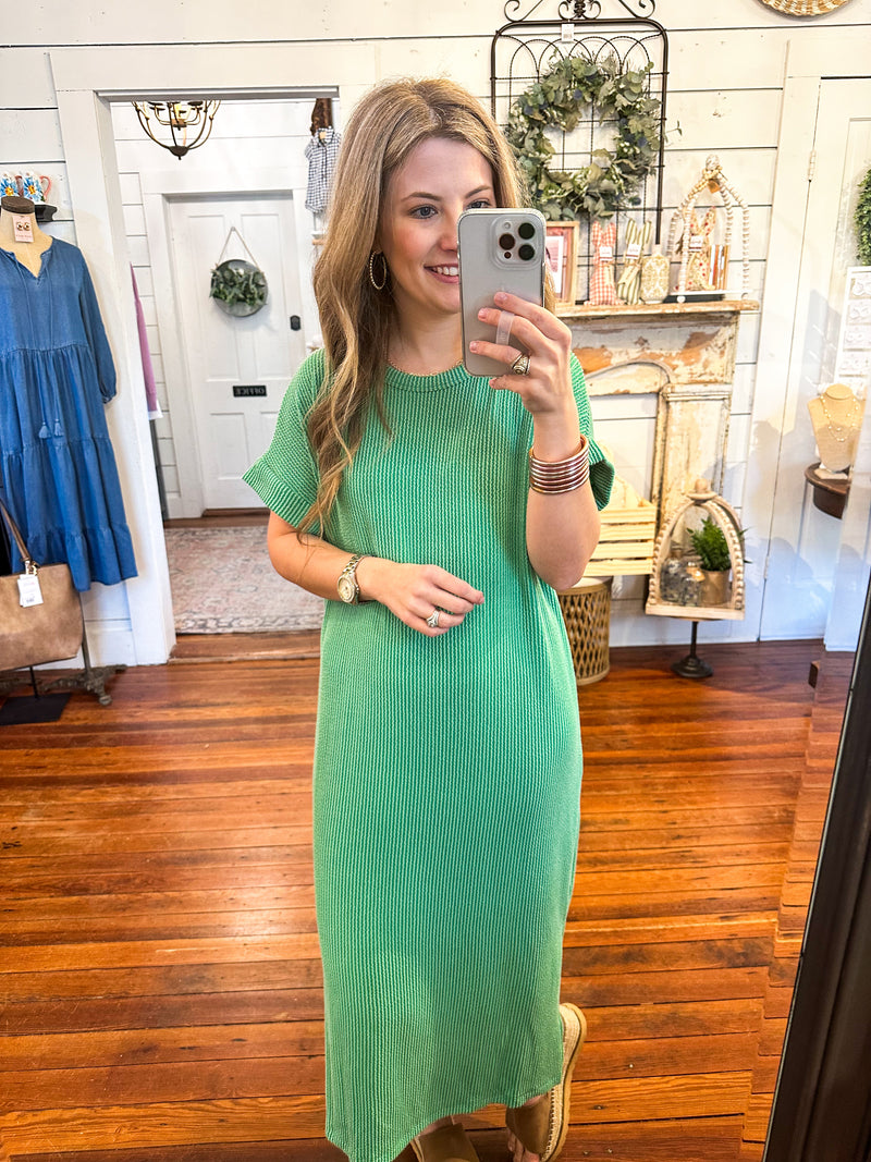 green ribbed dress with side slits and high low