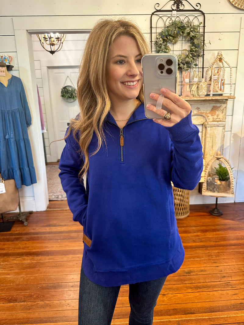 sapphire blue pullover with half zipper and pockets