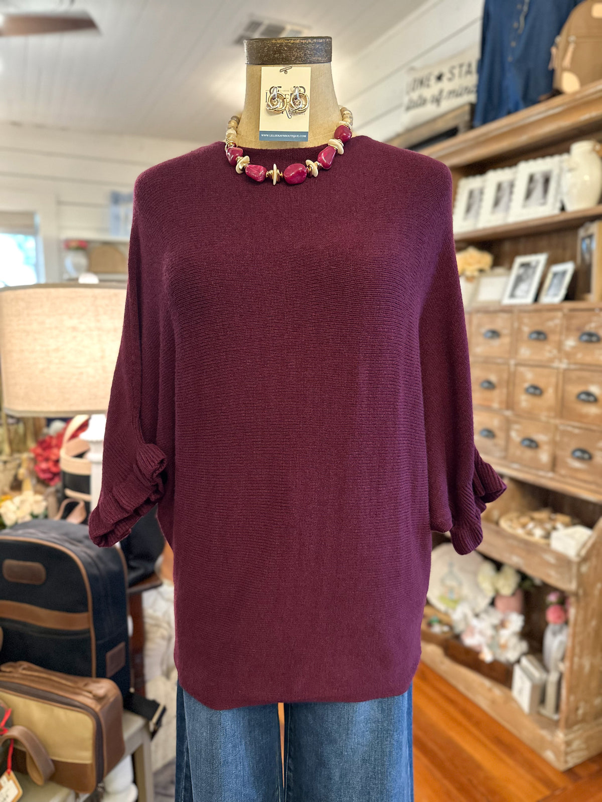 front view of burgundy sweater top
