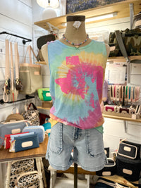 Mannequin wearing a tie-dye tank top and shorts in a store setting