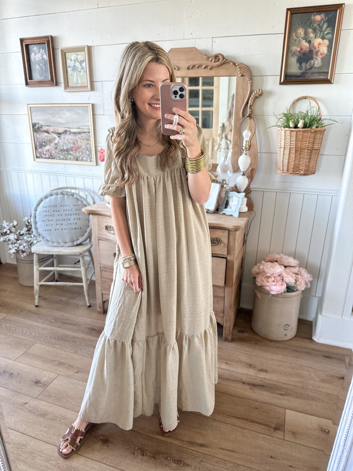 light tan linen style dress with ruffle details