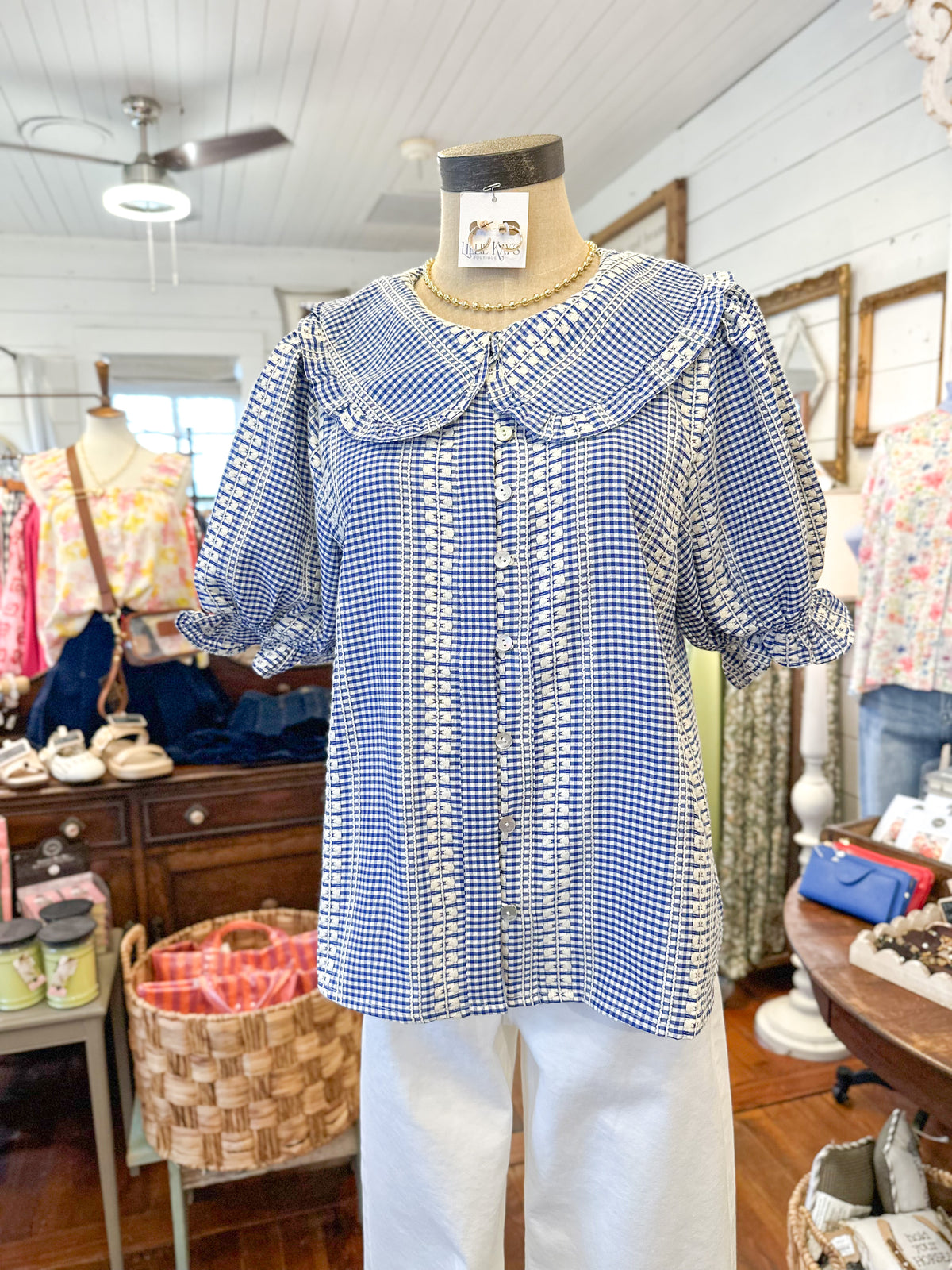 blue and cream printed button down blouse with peter pan style collar