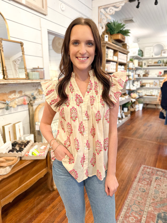 cream color flutter sleeve top with pink block print design thml