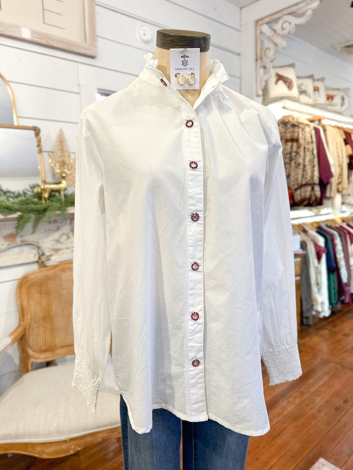 White button-up shirt on a mannequin with a tag in a store setting layerz clothing white renee top 