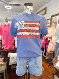 Blue t-shirt with a colorful graphic and denim shorts on a mannequin in a store setting.