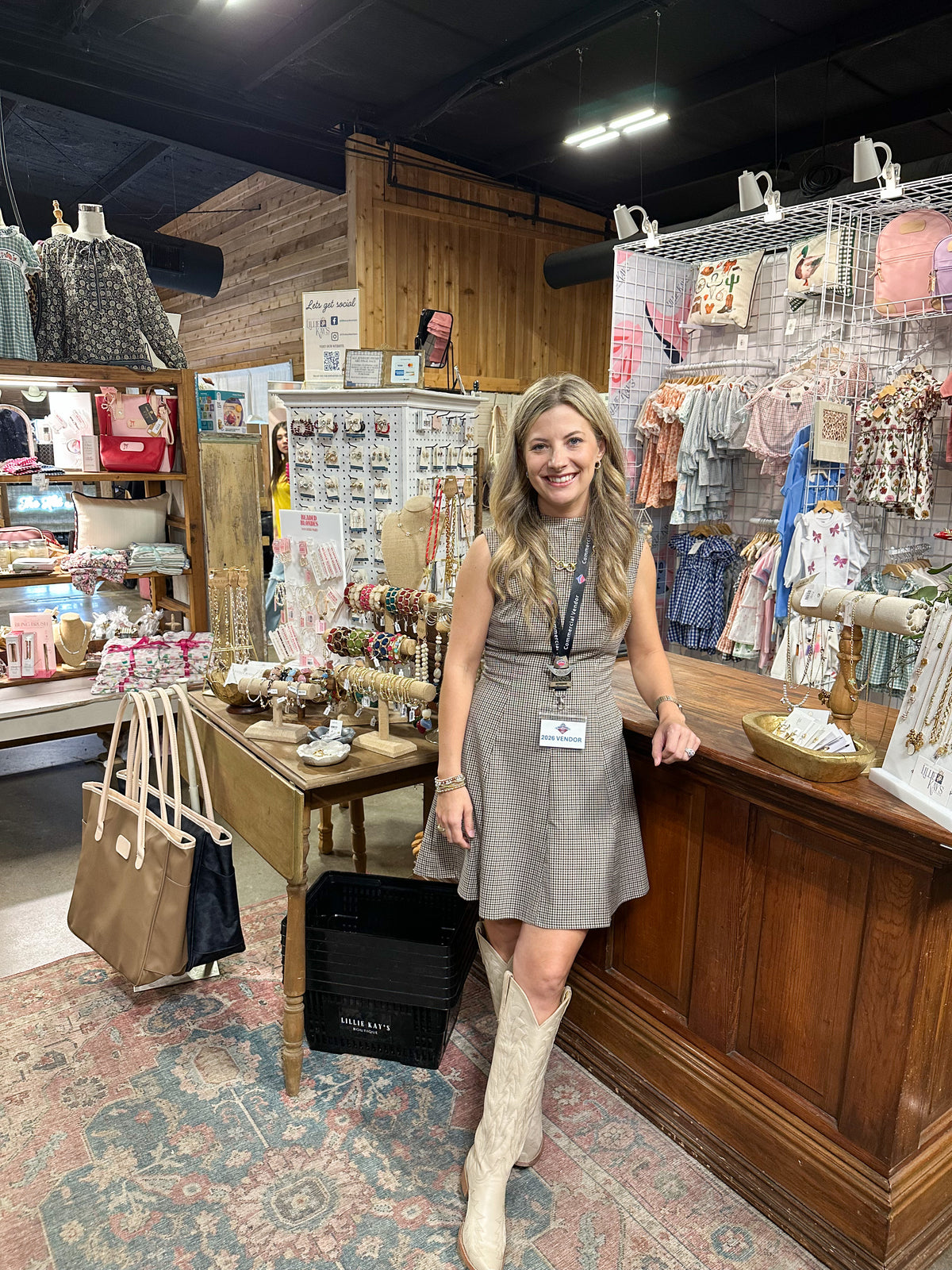 person wearing dress with boots in store setting 