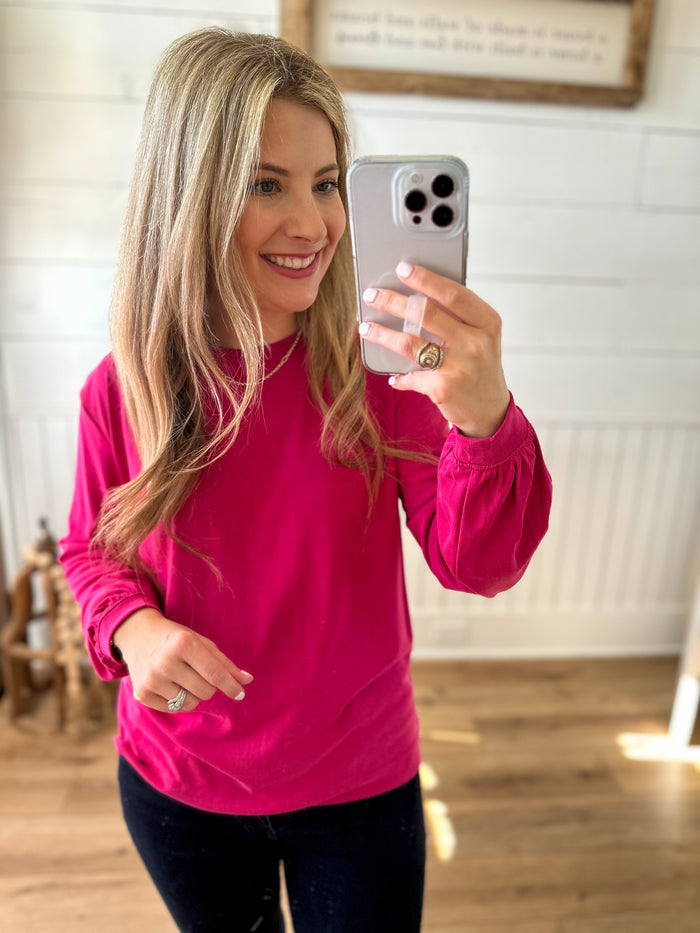 bright pink long sleeve top