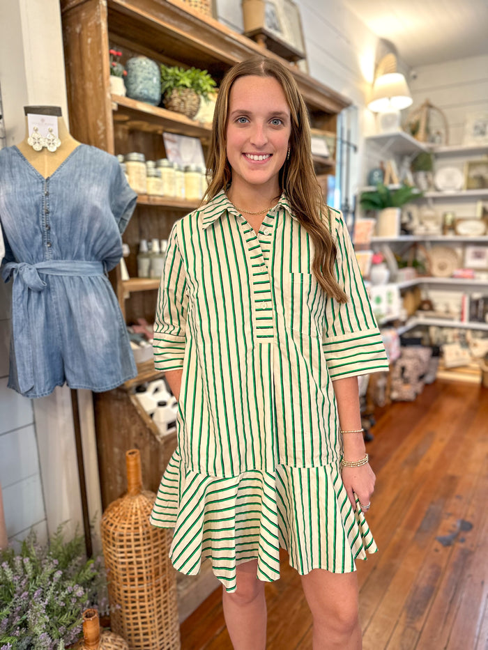 green stripe dress with ruffles along the hem on dress