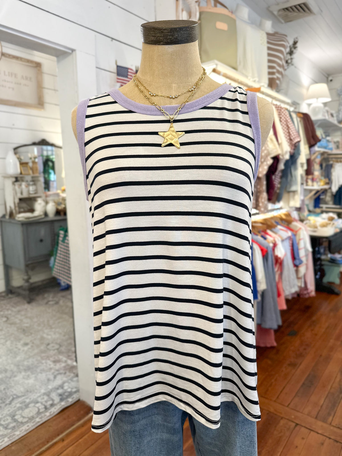 Striped tank top on a mannequin in a store setting