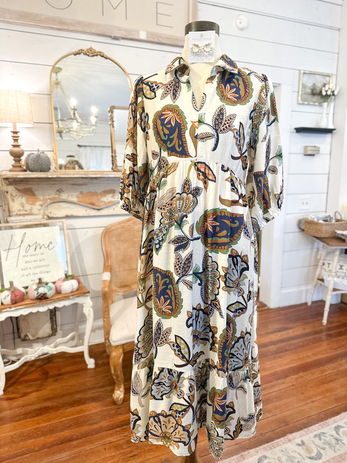 Mannequin wearing a floral dress in a home interior setting