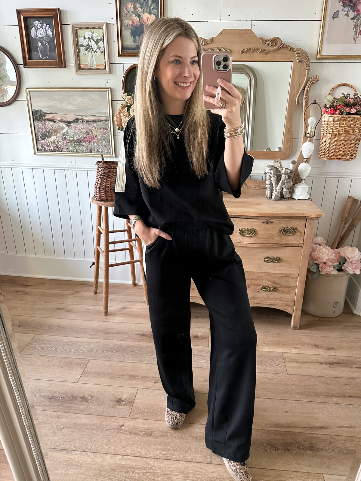 black matching loungewear set with top  and bottom with side contrast in cream 
