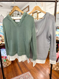 light green hooded pull over top with layered look