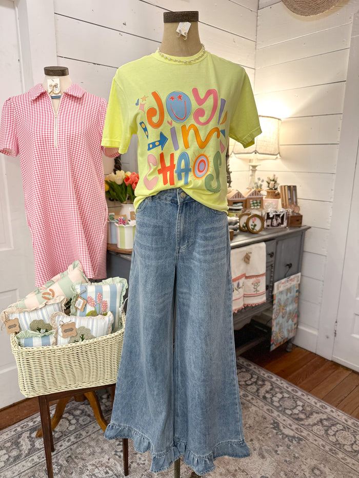 bright yellow joy in chaos tee 
ruffle hem jeans 
