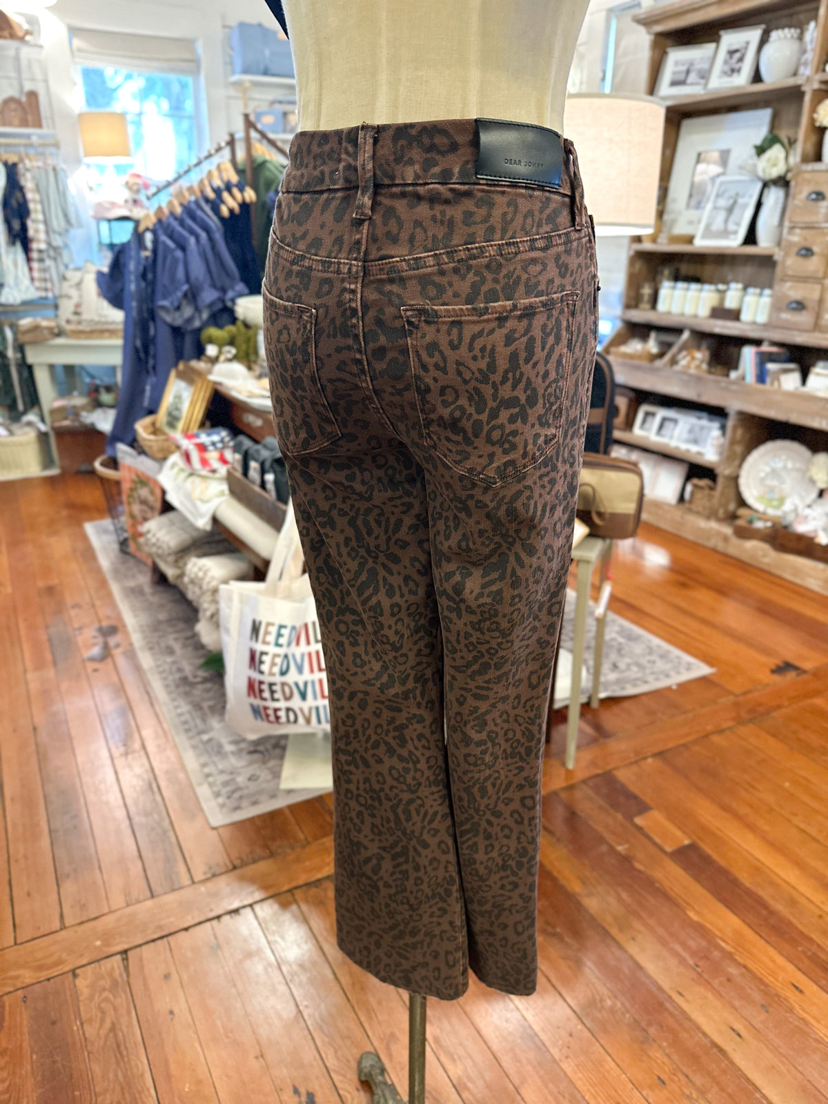 back view brown and black printed jean inside boutique store