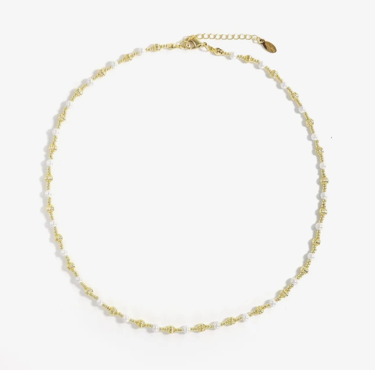Necklace with gold chain and white beads on a white background