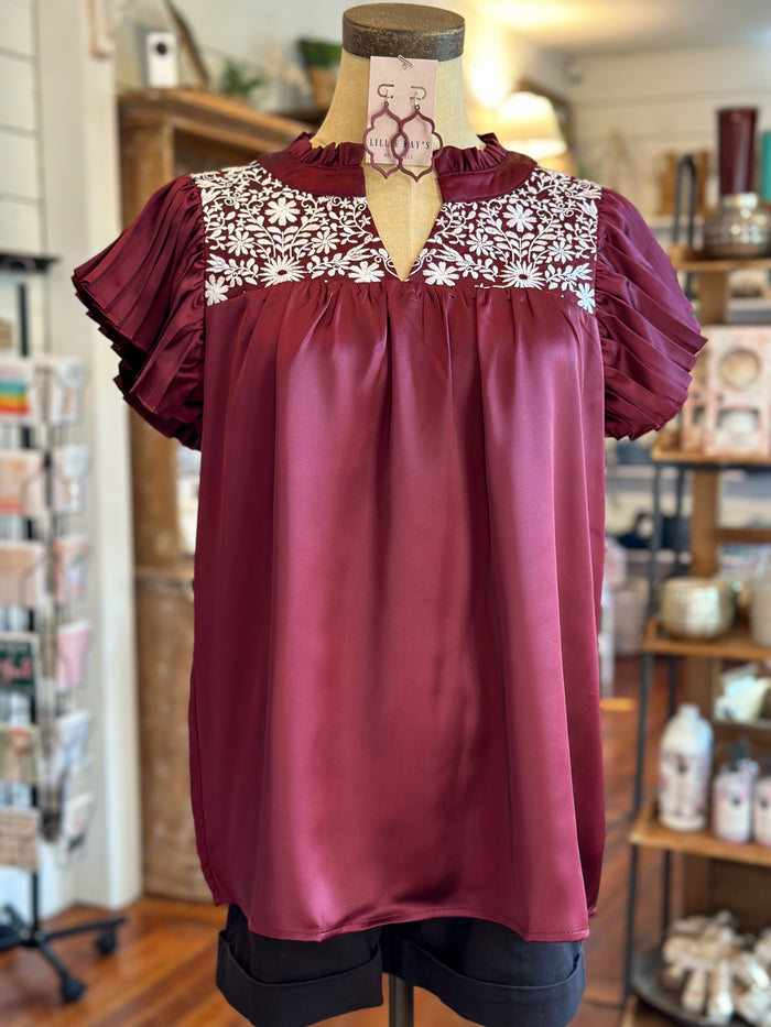 maroon washco top with white embroidery
