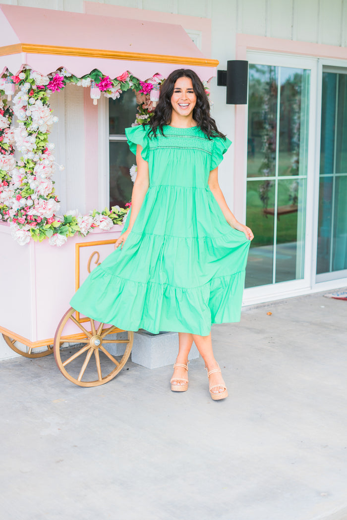 bright green maxi style dress with flutter sleeves