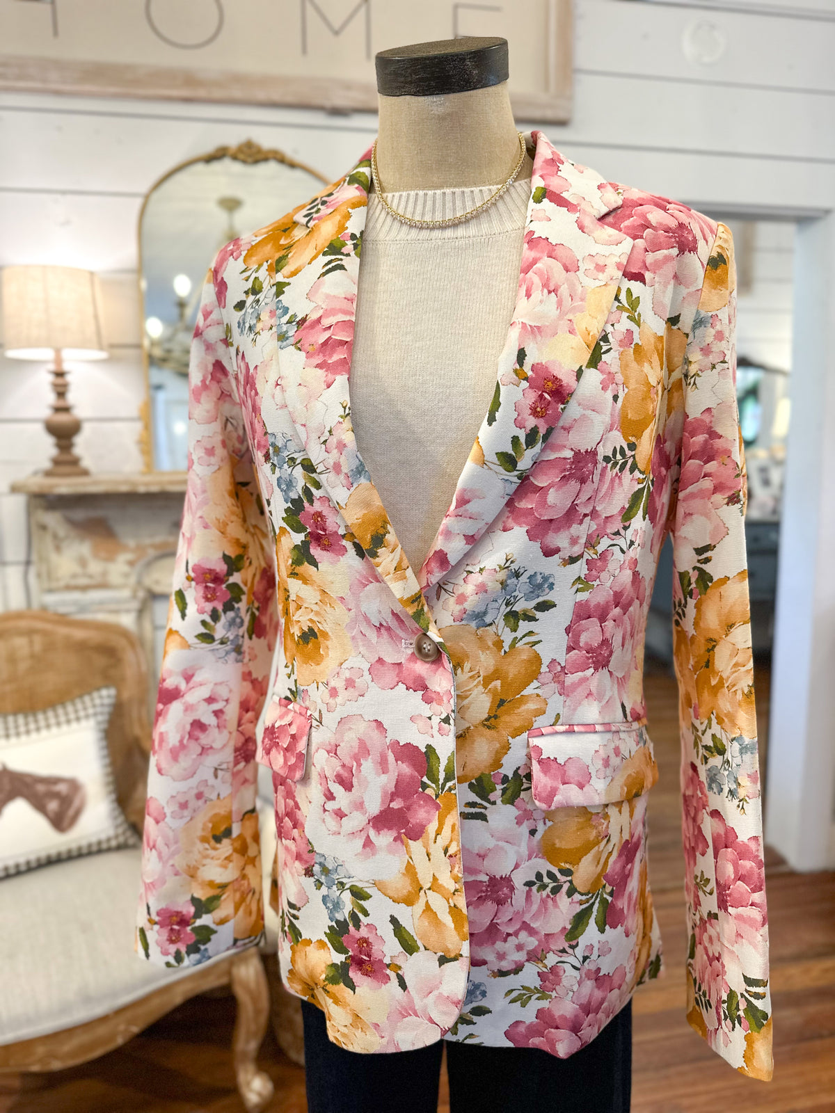 Floral patterned blazer on a mannequin in the store 