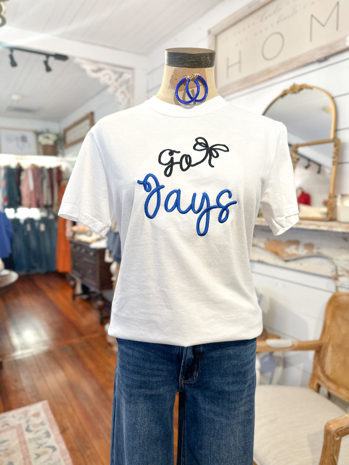 White t-shirt with 'Go Jays' text on a mannequin in a store setting