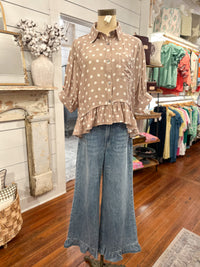 tan and cream polka dot top with ruffle jeans 