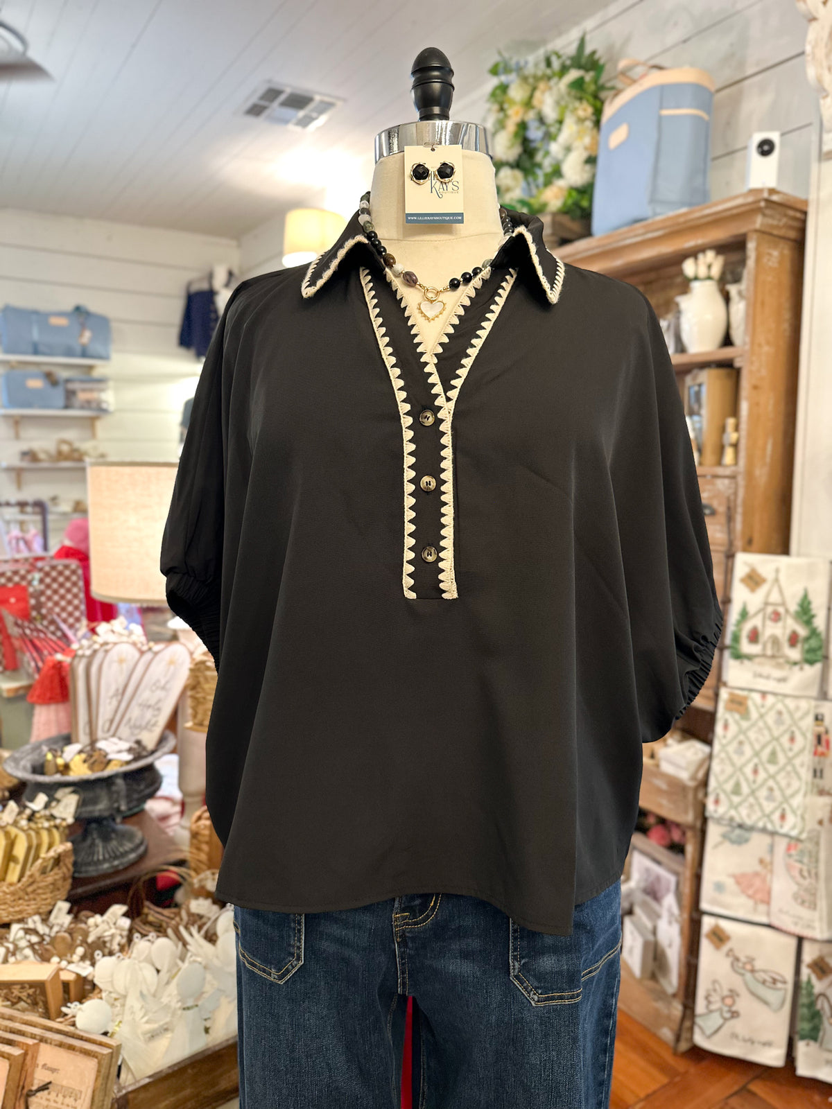 black dolman sleeve top with cream stitching 