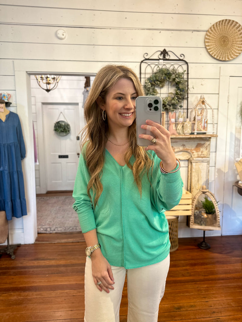 green loose fitting v neck with long sleeve